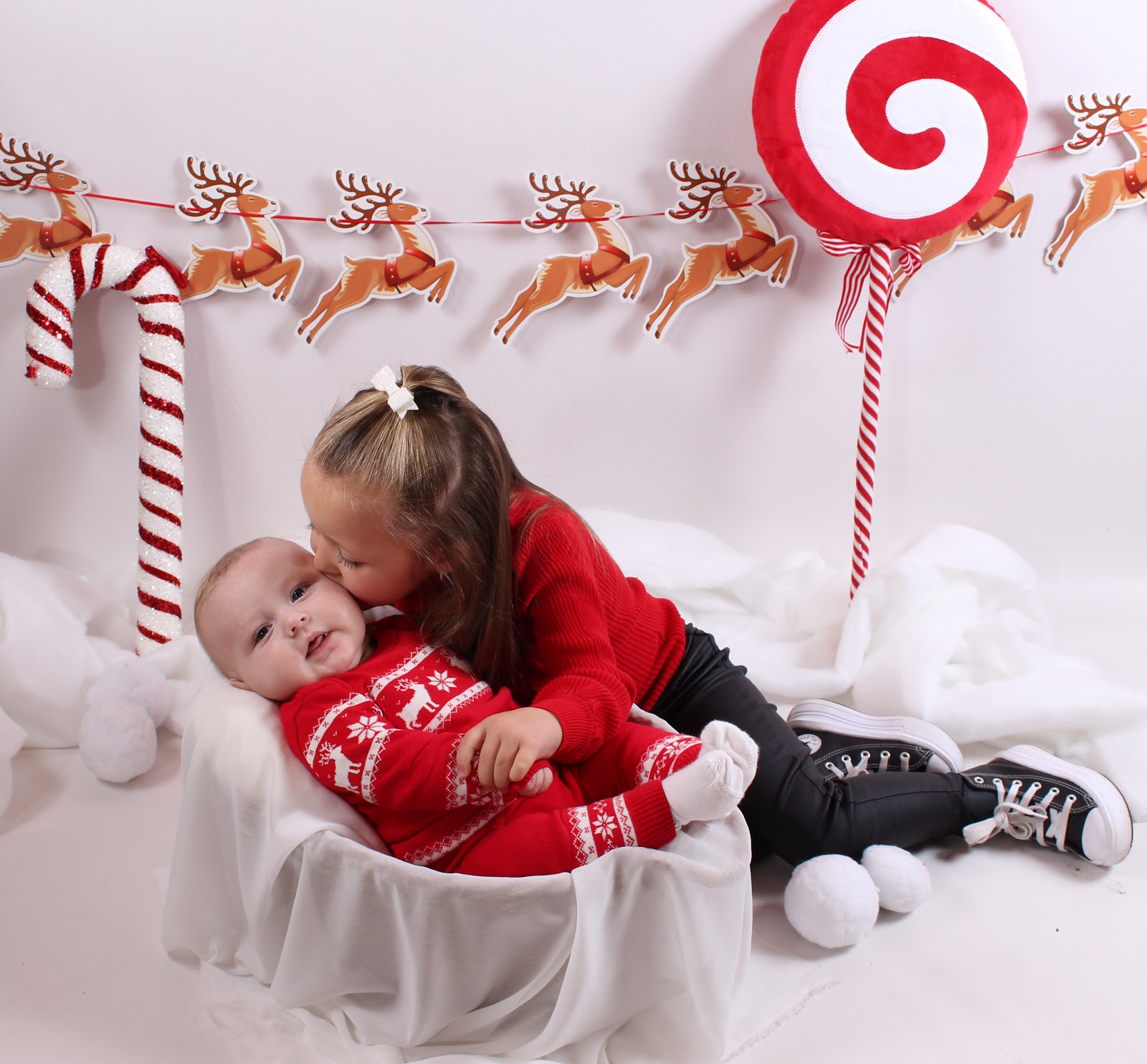 Two young children at a festive family studio session